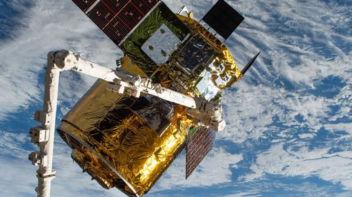 The HTV-X1 cargo spacecraft is pictured in the grip of the Canadarm2 robotic arm