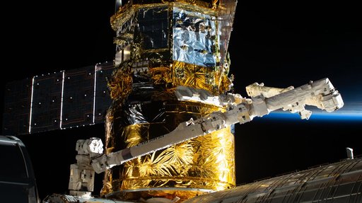 The HTV-X1 cargo spacecraft is pictured berthed to the Harmony module