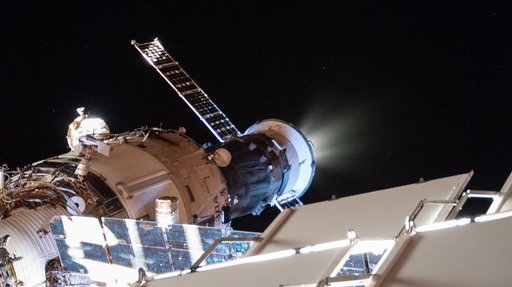 The Progress 93 cargo craft fires its engines to raise the International Space Station's orbit
