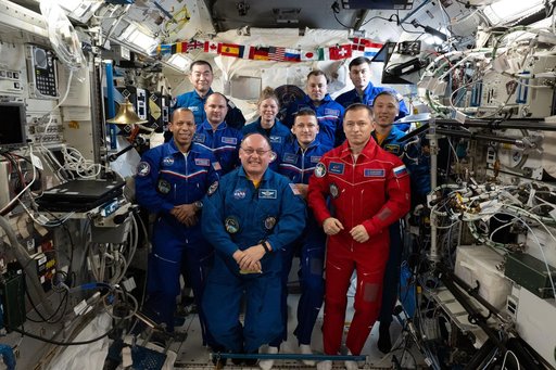Ten International Space Station crew members representing Expedition 73 and 74 pose for a portrait