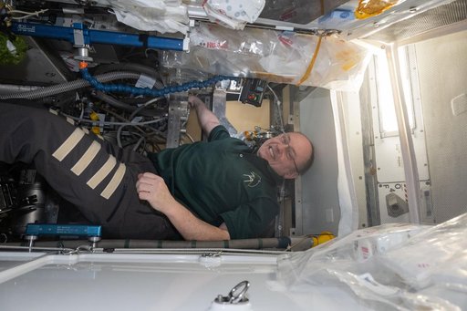 NASA astronaut Mike Fincke works inside the Tranquility module