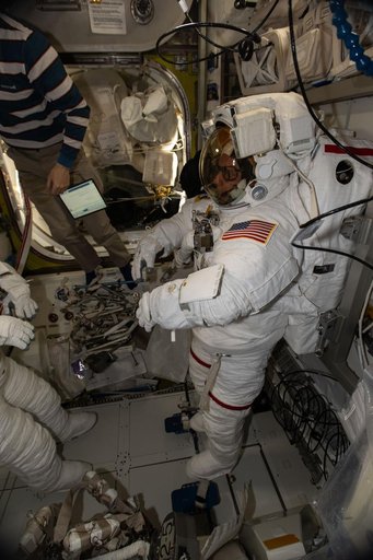 NASA astronaut Mike Fincke is pictured in his pressurized spacesuit