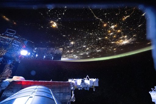 The International Space Station begins to shine brightly as it orbits into a sunrise