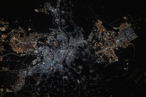 The Cairo metropolitan area is split by the Nile River at the base of the Nile Delta