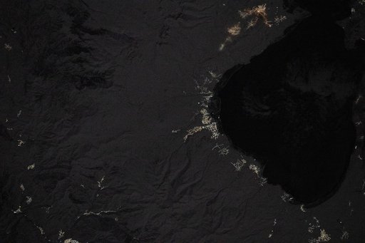 Villages light up the coastline in this nighttime image of Lake Sevan