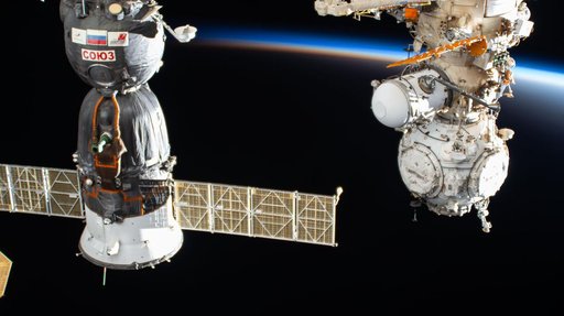 The International Space Station orbits into a sunset above China