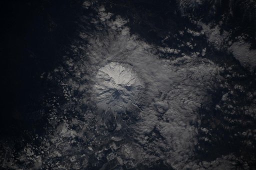 The snow-capped Mount Shasta is surrounded by clouds