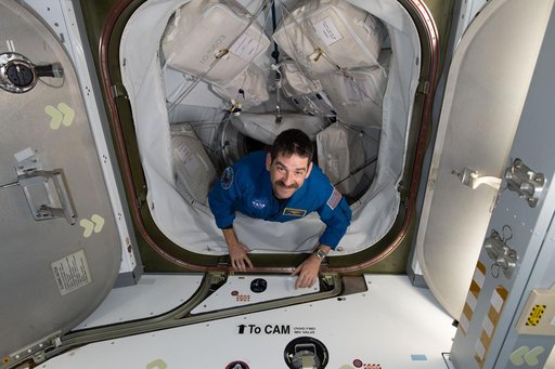 NASA astronaut Jack Hathaway enters the International Space Station