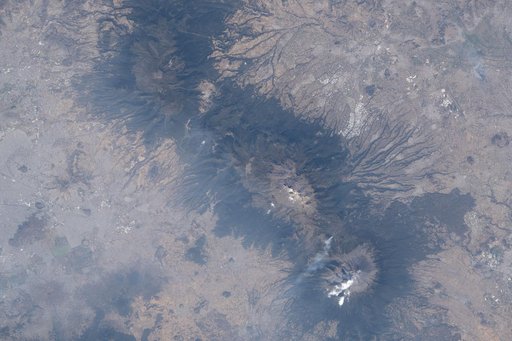 The three prominent mountaintops just east of Mexico City