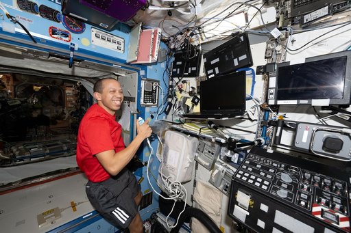 NASA astronaut Chris Williams calls down to mission controllers during Crew Medical Officer training