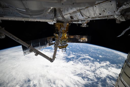 The HTV-X1 cargo craft and the Canadarm2 robotic arm