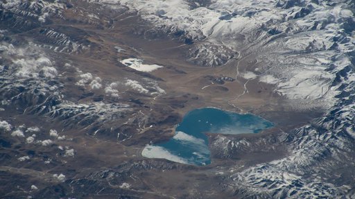 Peiku Lake in southwest China is surrounded by Himalayan peaks