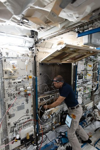 NASA astronaut Chris Williams configures advanced robotics hardware