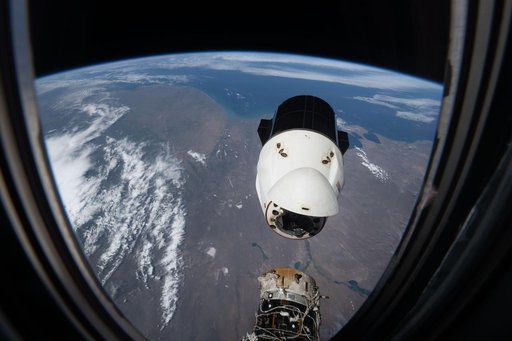 A SpaceX Dragon spacecraft backs away from the International Space Station