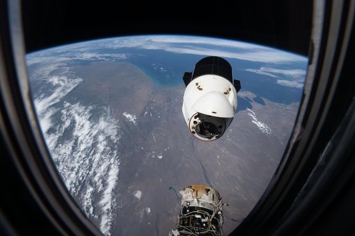 A SpaceX Dragon spacecraft backs away from the International Space Station