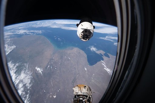 A SpaceX Dragon spacecraft backs away from the International Space Station