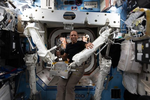 NASA astronaut Chris Williams familiarizes himself with spacewalking hardware