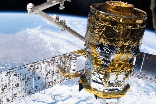The HTV‑X1 cargo spacecraft is in the grasp of the Canadarm2 robotic arm