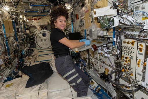 NASA astronaut Jessica Meir processes samples for the StarSteel experiment