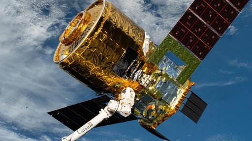 The HTV‑X1 cargo spacecraft from JAXA is grasped by the Canadarm2 robotic arm