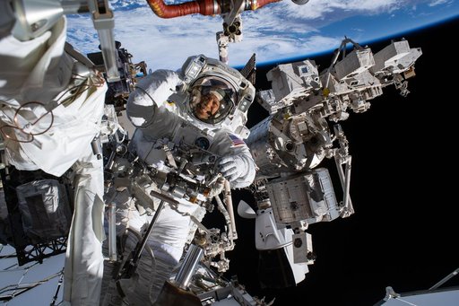 NASA astronaut Chris Williams smiles at the camera during a spacewalk