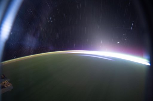 Star trails and an orbital sunrise above the southern Indian Ocean