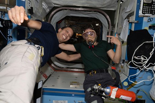 NASA astronauts Chris Williams and Jessica Meir pose for a portrait
