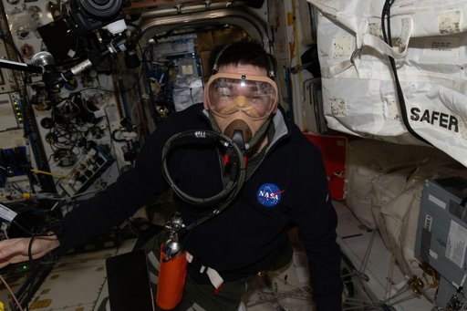NASA astronaut Jack Hathaway wears a portable breathing apparatus