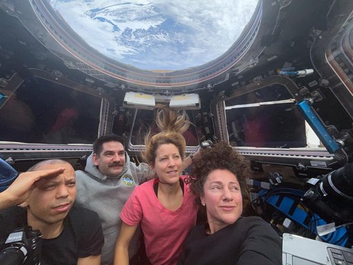 Expedition 74 flight engineers waiting to observe the plasma trail of the Orion spacecraft