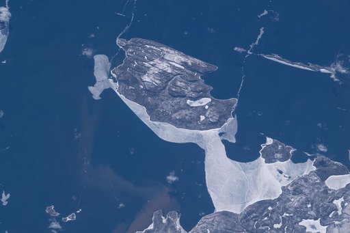 Canada’s uninhabited Pie Island surrounded by partial ice cover