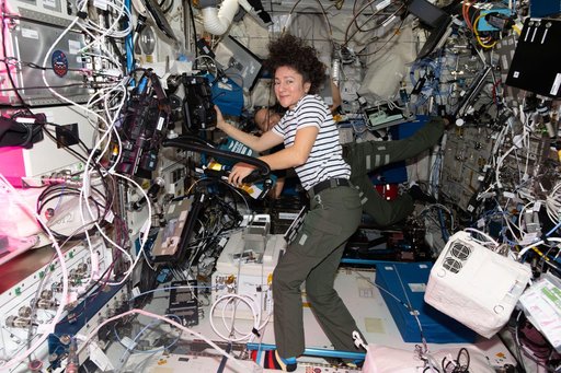 Astronauts Jessica Meir and Chris Williams work together inside the Columbus laboratory module