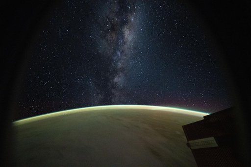 The Milky Way rises above Earth's atmospheric glow