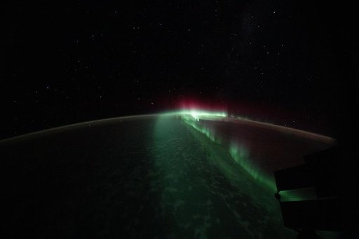 The aurora australis streams serenely above the Indian Ocean