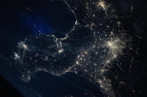 Italy’s darkened Po Valley contrasts with the brighter city lights that surround the region