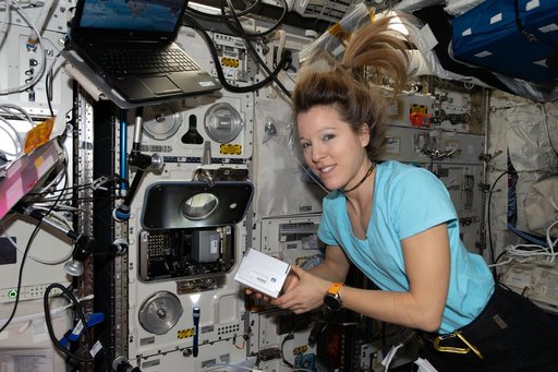 ESA astronaut Sophie Adenot prepares to install new research hardware in the BioLab facility