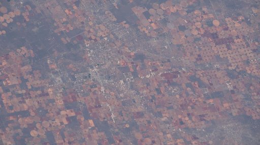 Industrial-scale farming and oil production exist side-by-side in western Texas