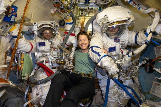 Cosmonauts Sergey Kud-Sverchkov and Sergei Mikaev try on their Orlan spacesuits