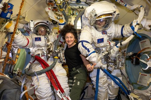 Cosmonauts Sergey Kud-Sverchkov and Sergei Mikaev try on their Orlan spacesuits