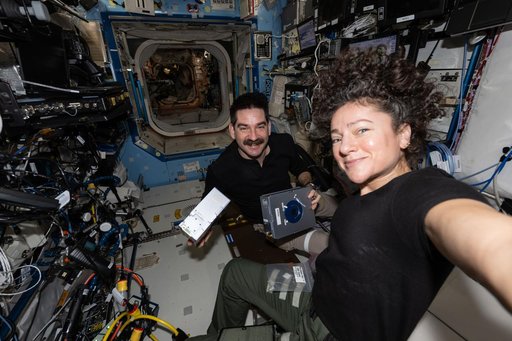 NASA astronauts Jack Hathaway and Jessica Meir pose together for a portrait during research activities