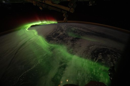 The aurora australis arcs over Earth during an active solar event