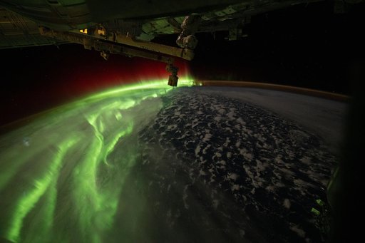 The aurora australis streams across Earth during an active solar event