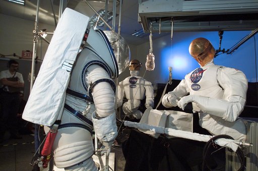 Robonaut joint task operations with astronaut Nancy Currie.
