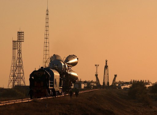Soyuz TMA-3 and booster rocket transport and raise on launch pad at Baikonur Cosmodrome