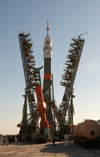 Soyuz TMA-3 and booster rocket transport and raise on launch pad at Baikonur Cosmodrome