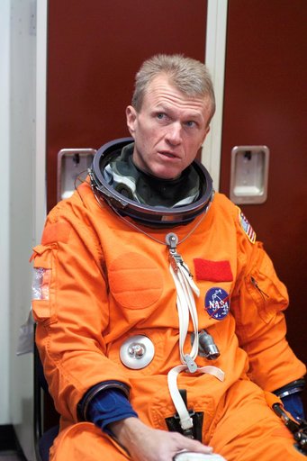 STS-115 crew during suited egress training on the Full Fuselage Trainer (FFT) mockup.