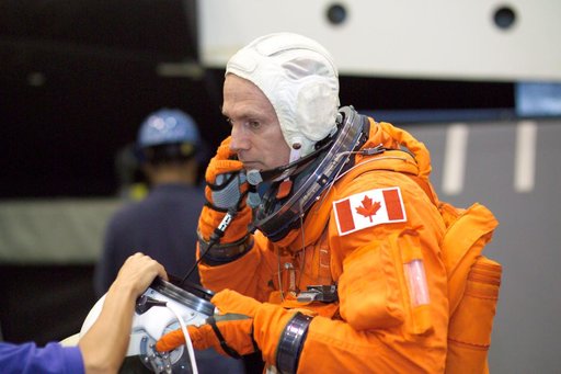 STS-115 crew during suited egress training on the Full Fuselage Trainer (FFT) mockup.