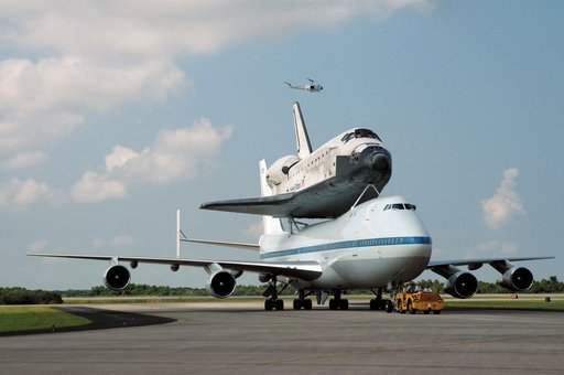 The Space Shuttle Discovery, atop a specially modified Boeing 747
