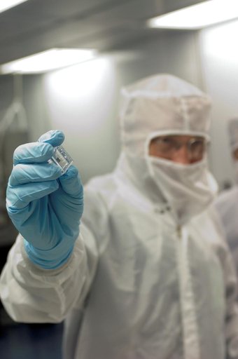 Francois Robert receives a sample from the Stardust Experiment