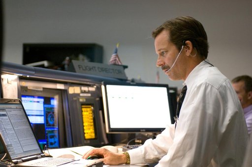 Expedition 13 flight controller on console during mission - Orbit 1, BFCR