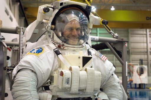 STS-122 crew member Stan Love suiting up